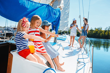 Image showing The children on board of sea yacht