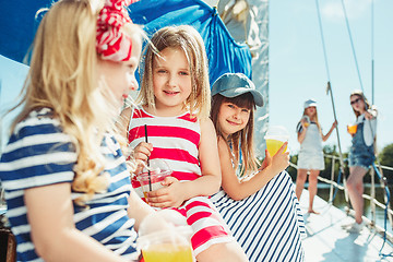 Image showing The children on board of sea yacht