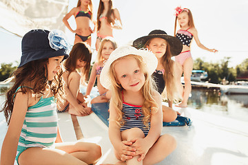 Image showing The children on board of sea yacht