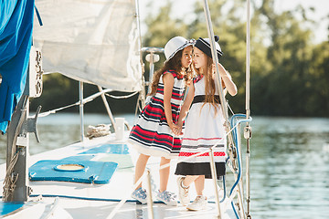 Image showing The children on board of sea yacht