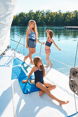 Image showing The children on board of sea yacht