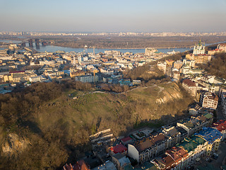 Image showing A bird\'s eye view, aerial view from drone of the Podol district, oldest historical center of Kiev, Ukraine, the Dnieper River and the left bank of Dnieper