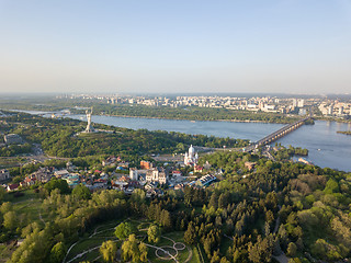 Image showing Aerial view beautiful panorama of the city of Kiev, a botanical garden and the Dnieper river against the blue sky