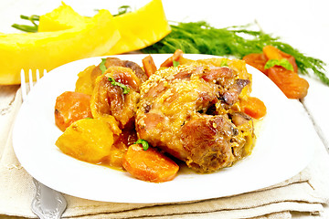 Image showing Chicken roast with pumpkin and dried apricots on board 