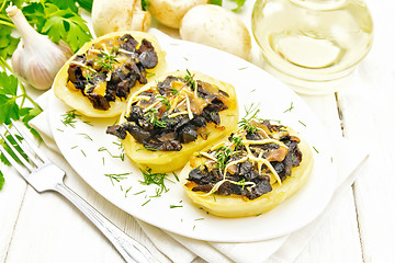 Image showing Potatoes stuffed with mushrooms on light board