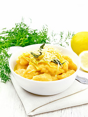 Image showing Gnocchi pumpkin in bowl on light wooden board