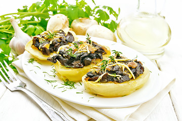 Image showing Potatoes stuffed with mushrooms on white board