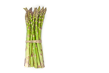 Image showing Bunch of fresh raw garden asparagus isolated on white background