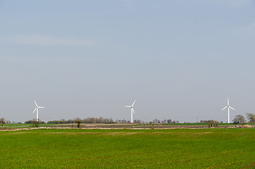 Image showing Windmills in a green landscape at the swedish countryside