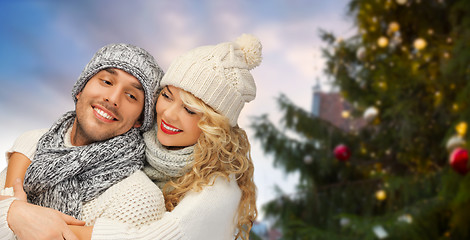 Image showing happy couple hugging over christmas tree