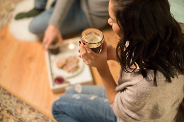 Image showing close up of woman drinking coffee at home