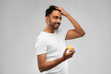 Image showing indian man applying hair wax or styling gel