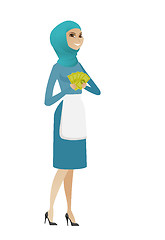 Image showing Young muslim cleaner holding money.