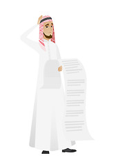 Image showing Muslim accountant holding a long bill.