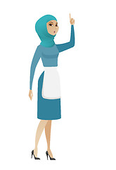 Image showing Muslim cleaner with open mouth pointing finger up.