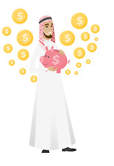 Image showing Muslim businessman holding a piggy bank.