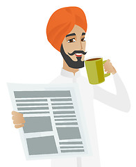 Image showing Businessman drinking coffee and reading newspaper.