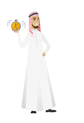 Image showing Muslim businessman holding alarm clock.