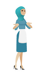 Image showing Confused young muslim cleaner shrugging shoulders.