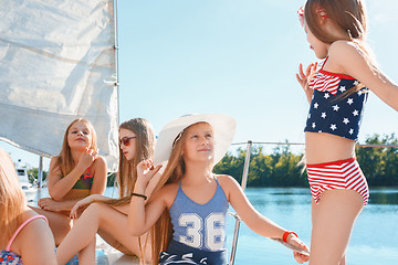 Image showing The children on board of sea yacht