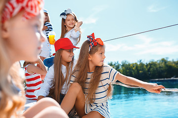 Image showing The children on board of sea yacht