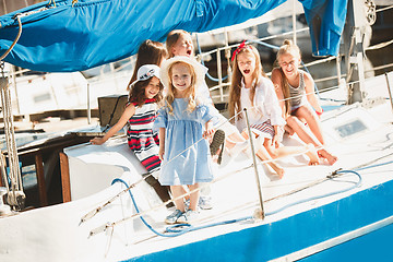 Image showing The children on board of sea yacht