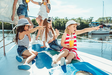 Image showing The children on board of sea yacht