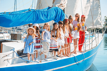 Image showing The children on board of sea yacht