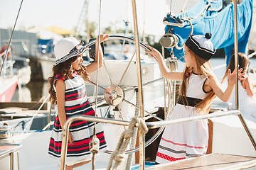 Image showing The children on board of sea yacht