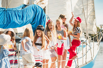 Image showing The children on board of sea yacht