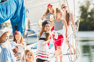 Image showing The children on board of sea yacht