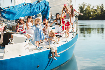 Image showing The children on board of sea yacht