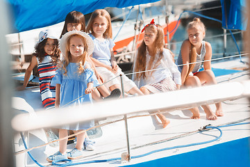 Image showing The children on board of sea yacht