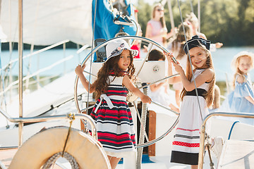 Image showing The children on board of sea yacht