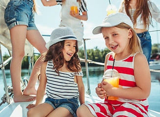 Image showing The children on board of sea yacht