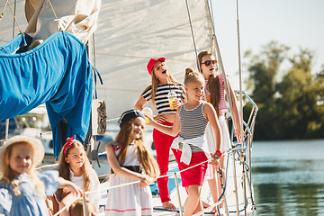 Image showing The children on board of sea yacht