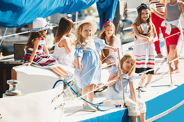 Image showing The children on board of sea yacht