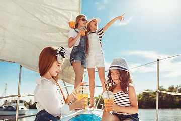 Image showing The children on board of sea yacht