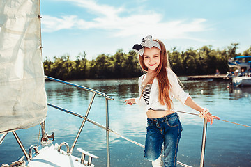 Image showing The children on board of sea yacht