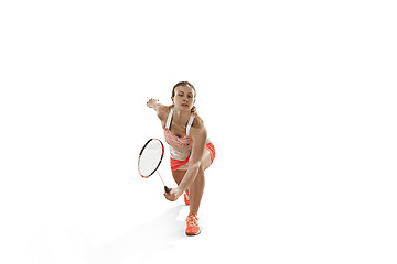 Image showing Young woman playing badminton over white background