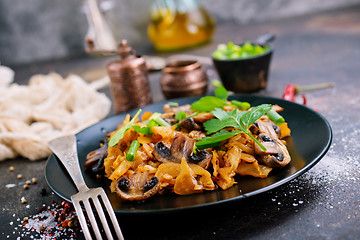 Image showing Fried mushrooms and cabbage