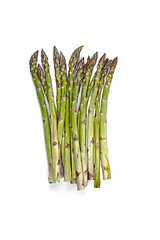 Image showing Bunch of fresh raw garden asparagus isolated on white background