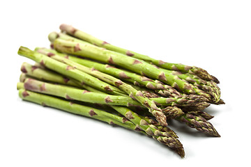 Image showing Bunch of fresh raw garden asparagus isolated on white background