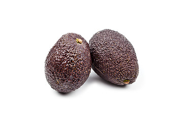 Image showing Two fresh organic avocado isolated on white background.