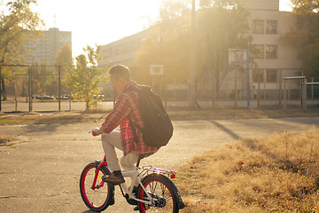 Image showing Happy man ride the bicycle