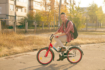 Image showing Happy man ride the bicycle