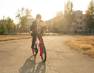 Image showing Happy boy ride the bicycle