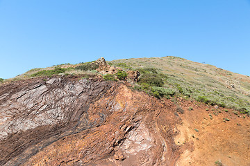 Image showing close up of hill or mountain over blue sky