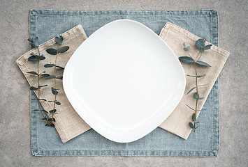 Image showing Elegant table setting decorated with eucalyptus branches