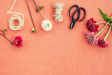 Image showing Florist workspace on peach colored canvas background